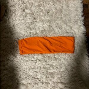 Size medium, orange swim bando top.